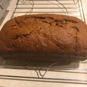 Loaf of banana bread on a cooling rack